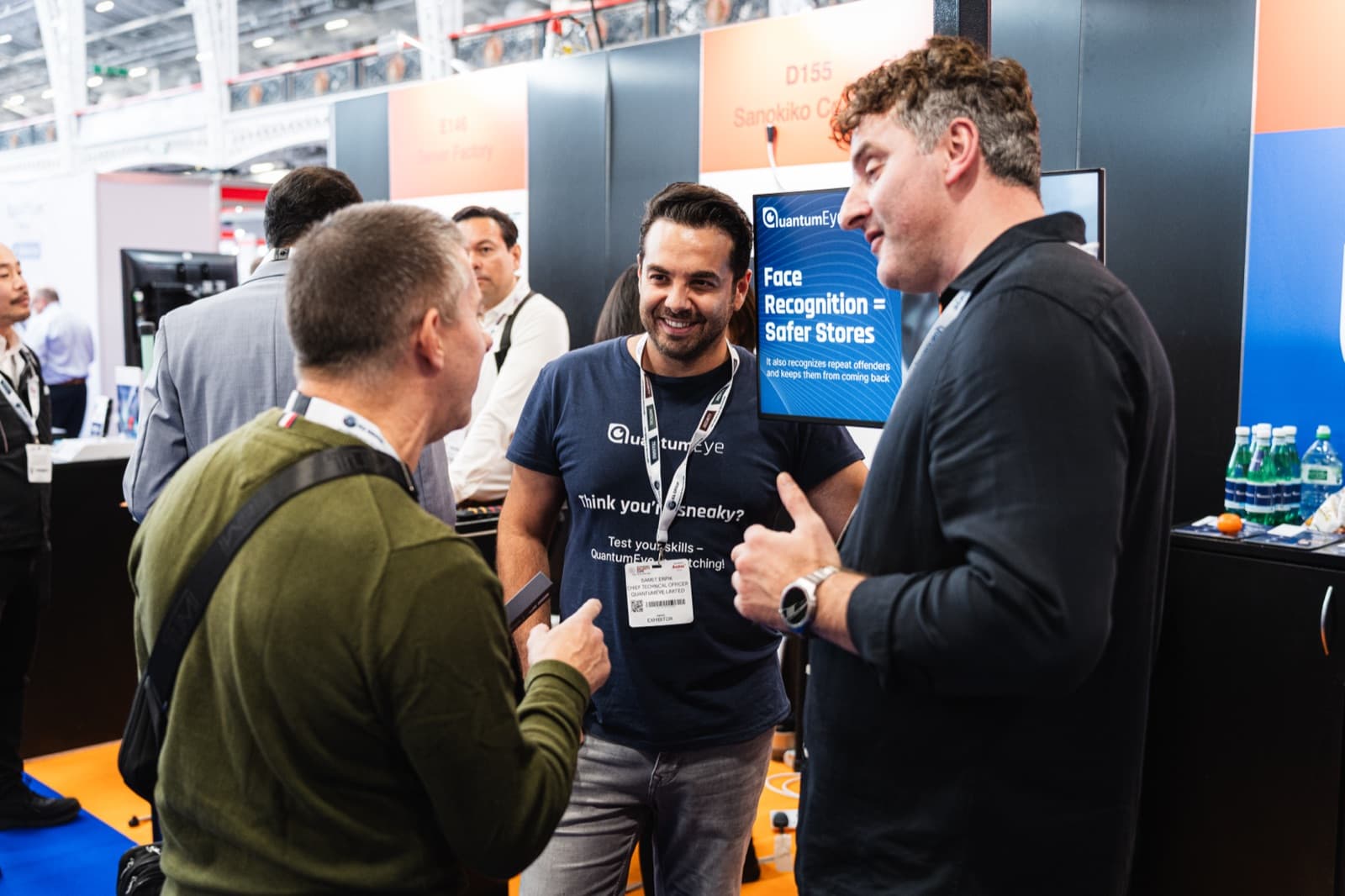 Osman Goral, QuantumEye CEO, and the team in conversation with a visitor at the QuantumEye stand.